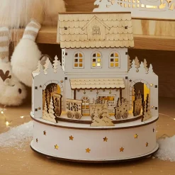 KAEMINGK Village de Noël en bois lumineux et musical à piles (H19 cm) Maison de famille Hot